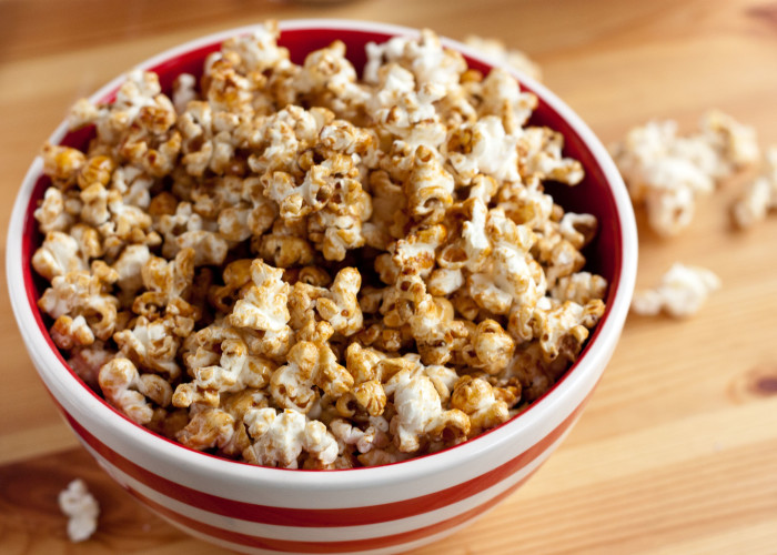 Brown Sugar Kettle Corn in a striped bowl