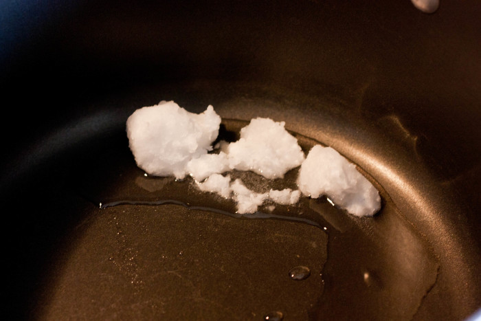 Coconut Oil melting in a pot on the stove