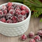 Sugared Cranberries have a sugary crust on the outside, but pop open to reveal their tart insides when you bite them. They're easier to make than you think, and they're the perfect accent for all your holiday baking and cocktails.