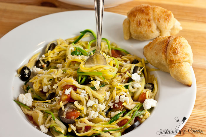 A quick, healthy dinner recipe. Greek Zucchini Noodles (Zoodles) with Feta, Olives, Artichokes and Tomatoes.