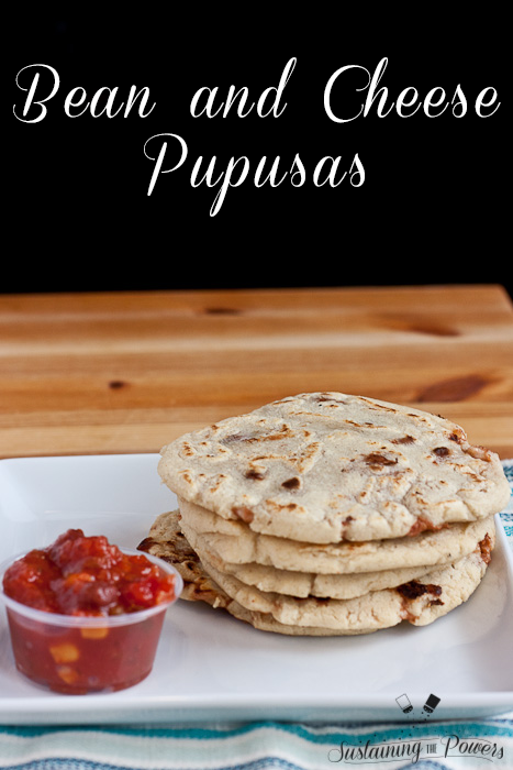 A stack of bean and cheese pupusas with salsa.