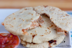 These look yummy and I'm so excited they're gluten-free! Salvadorean Pupusas are pillowy bean and cheese-stuffed corn tortillas.