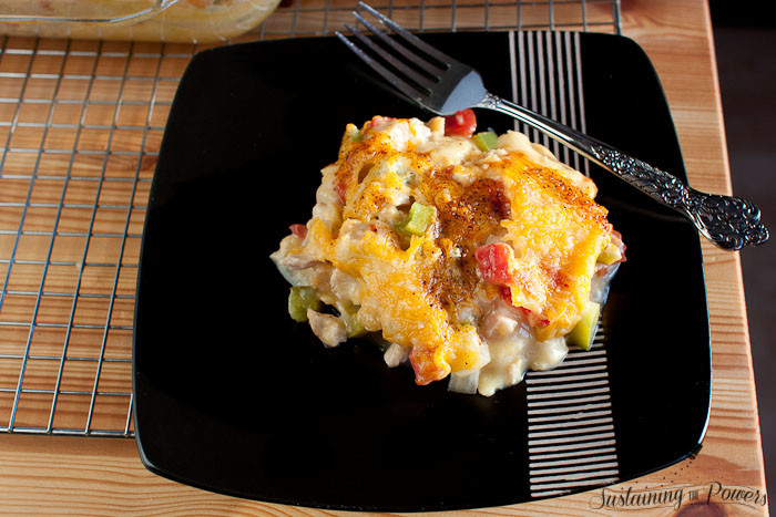 King Ranch Chicken - a creamy, cheesy, layered chicken enchilada casserole. This always disappears first at potlucks!