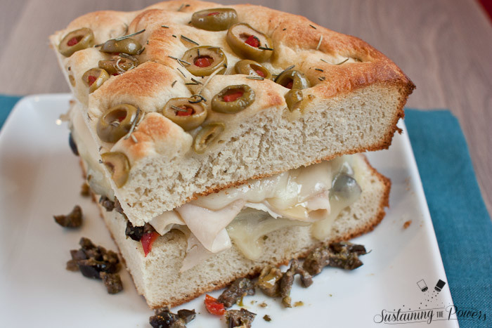 Turkey muffulettas should be the national sandwich. I can't get enough! This simplified recipe for a turkey muffuletta combines olive focaccia, turkey, provolone, and olive salad in a toasted sandwich. 