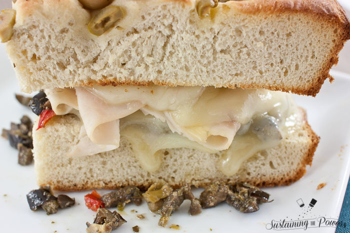 Turkey muffulettas should be the national sandwich. I can't get enough! This simplified recipe for a turkey muffuletta combines olive focaccia, turkey, provolone, and olive salad in a toasted sandwich. 