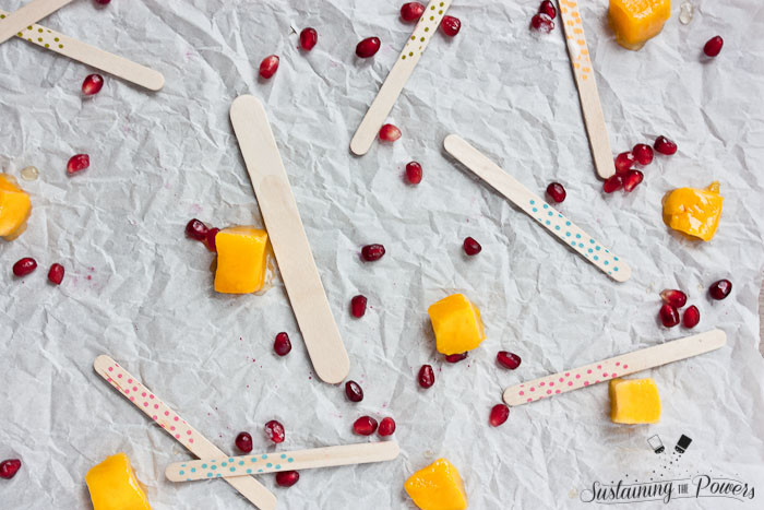 These popsicles taste like a pomegranate pina colada and a mango lassi had a baby and stuck it in the freezer. Yum!