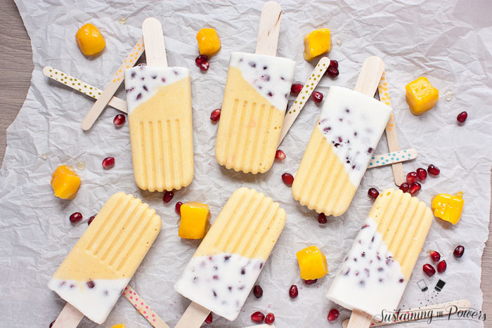 These popsicles taste like a pomegranate pina colada and a mango lassi had a baby and stuck it in the freezer. Yum!