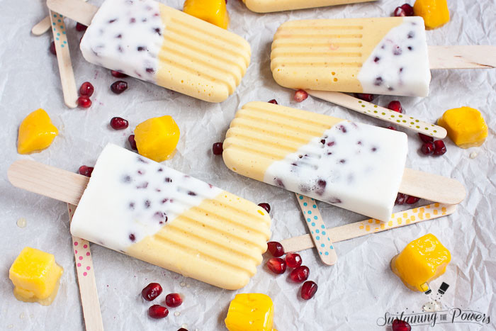 These popsicles taste like a pomegranate pina colada and a mango lassi had a baby and stuck it in the freezer. Yum!