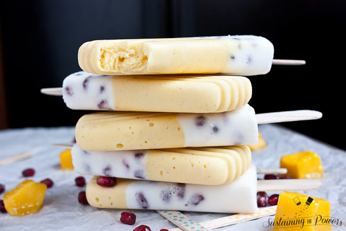 These popsicles taste like a pomegranate pina colada and a mango lassi had a baby and stuck it in the freezer. Yum!