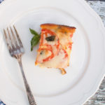 This Tomato, Basil, and Mozzarella Layered Egg Bake (Strata) is a cross between a fritatta and a bread pudding. Super cheap and you'll definitely impress your guests!