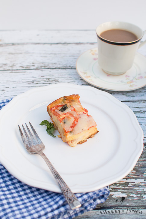 This Tomato, Basil, and Mozzarella Layered Egg Bake (Strata) is a cross between a fritatta and a bread pudding. Super cheap and you'll definitely impress your guests!