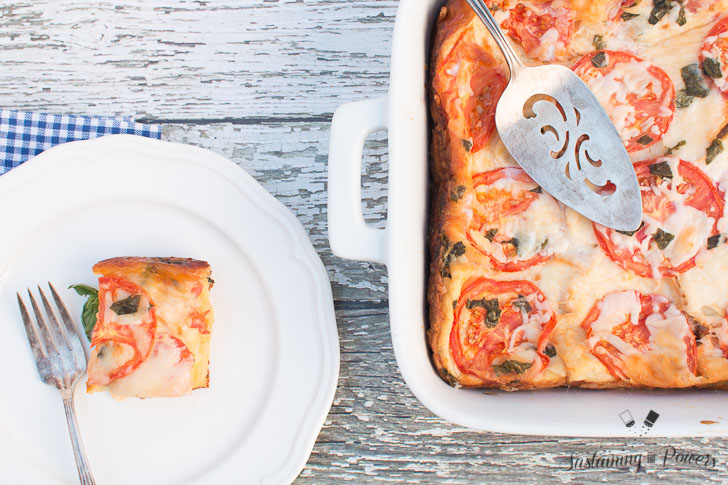 This Tomato, Basil, and Mozzarella Layered Egg Bake (Strata) is a cross between a fritatta and a bread pudding. Super cheap and you'll definitely impress your guests!