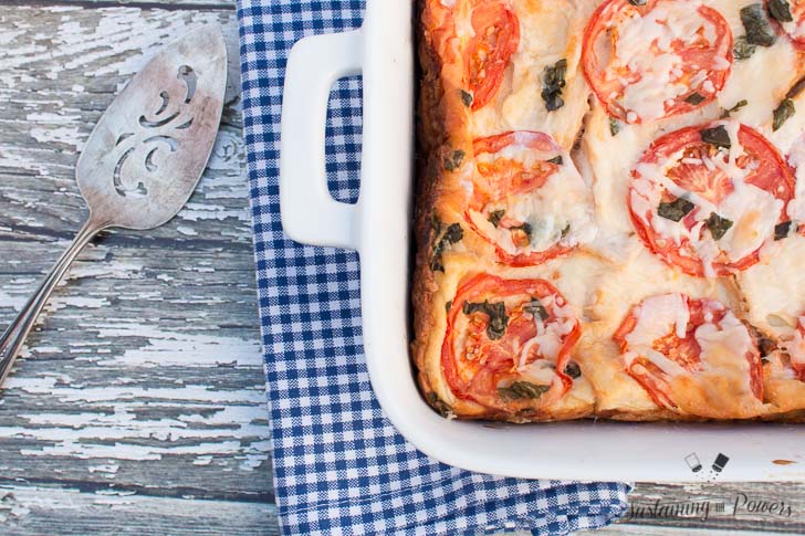 This Tomato, Basil, and Mozzarella Layered Egg Bake (Strata) is a cross between a fritatta and a bread pudding. Super cheap and you'll definitely impress your guests!