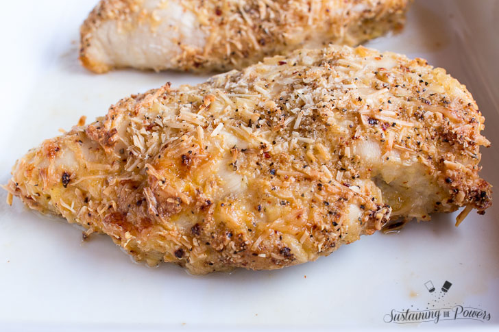 30 Minute Baked Italian Chicken - chicken, italian dressing mix, garlic powder, parmesan cheese, flour, and an egg are all you need! Our favorite weeknight meal.