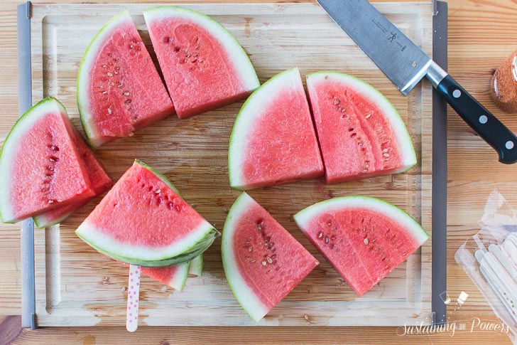 How to Make Chili Lime Watermelon Pops | These are seriously my favorite afternoon snack. You've got so many flavor profiles going on - sweet, salty, spicy, sour, and juicy watermelon. Plus it only takes about 5 minutes to put a whole pretty tray of these watermelon pops together! Click through to grab the recipe!