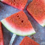 How to Make Chili Lime Watermelon Pops | These are seriously my favorite afternoon snack. You've got so many flavor profiles going on - sweet, salty, spicy, sour, and juicy watermelon. Plus it only takes about 5 minutes to put a whole pretty tray of these watermelon pops together! Click through to grab the recipe!