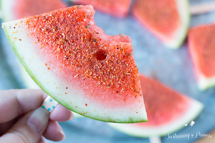 How to Make Chili Lime Watermelon Pops | These are seriously my favorite afternoon snack. You've got so many flavor profiles going on - sweet, salty, spicy, sour, and juicy watermelon. Plus it only takes about 5 minutes to put a whole pretty tray of these watermelon pops together! Click through to grab the recipe!