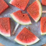 How to Make Chili Lime Watermelon Pops | These are seriously my favorite afternoon snack. You've got so many flavor profiles going on - sweet, salty, spicy, sour, and juicy watermelon. Plus it only takes about 5 minutes to put a whole pretty tray of these watermelon pops together! Click through to grab the recipe!