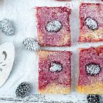 How to Make Blackberry Lemon Bars | Lemon bars are one of our favorite treats. I love the mixture of sweet and tart and a super thick shortbread crust. These have the added deliciousness of fresh blackberries that puts them totally over the top! Click through now to get the recipe!