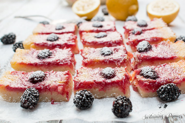 How to Make Blackberry Lemon Bars | Lemon bars are one of our favorite treats. I love the mixture of sweet and tart and a super thick shortbread crust. These have the added deliciousness of fresh blackberries that puts them totally over the top! Click through now to get the recipe! 