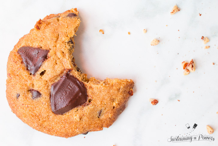 A single Brown Butter Chocolate Chip Cookie with a bite taken out of it. 